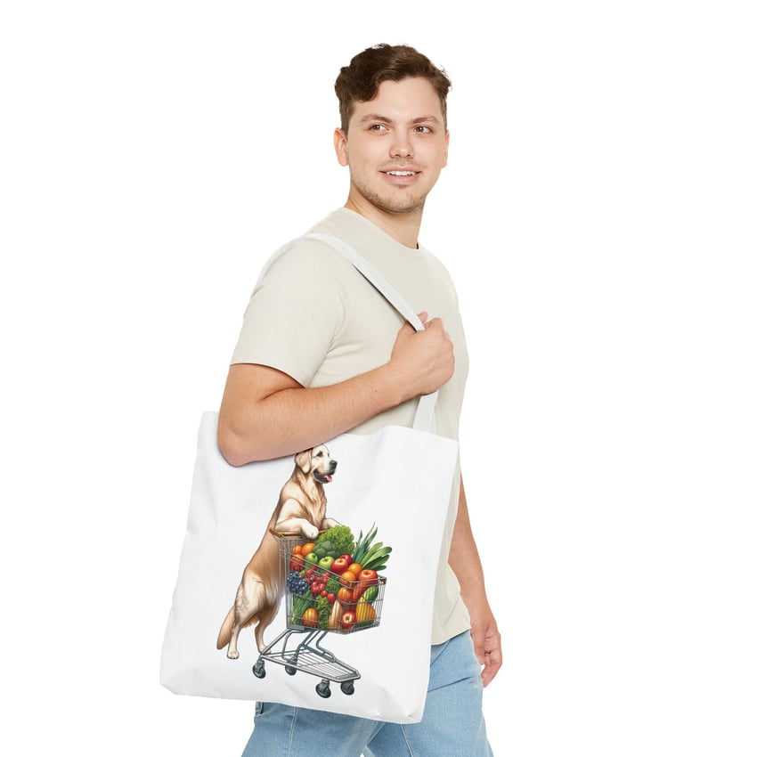 Man with playful dog tote bag, beige t-shirt, blue jeans, white background.