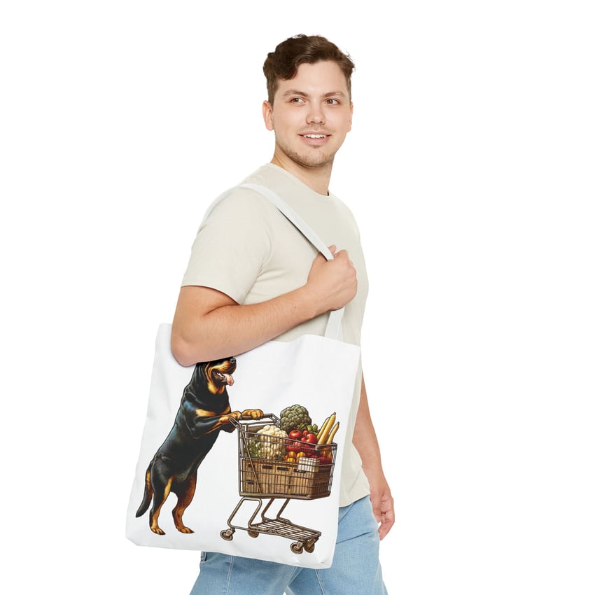 Young man with a humorous dog-themed tote bag on a minimalistic background.