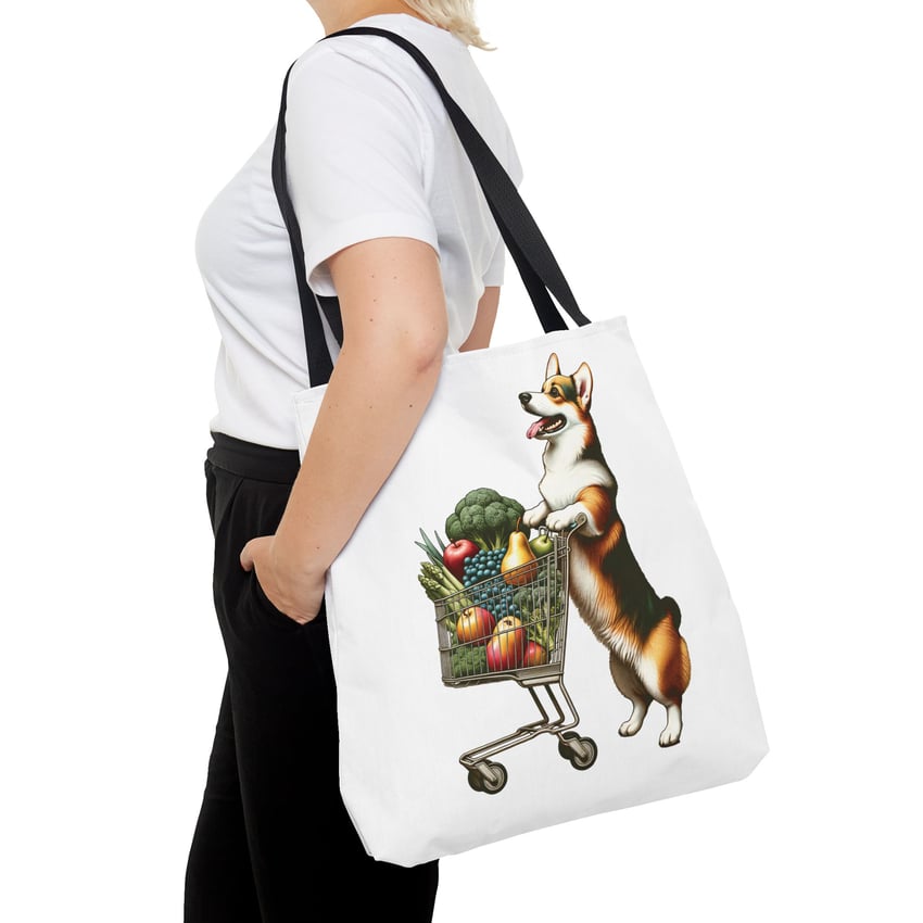 Stylish tote bag with lively corgi illustration pushing a grocery cart.
