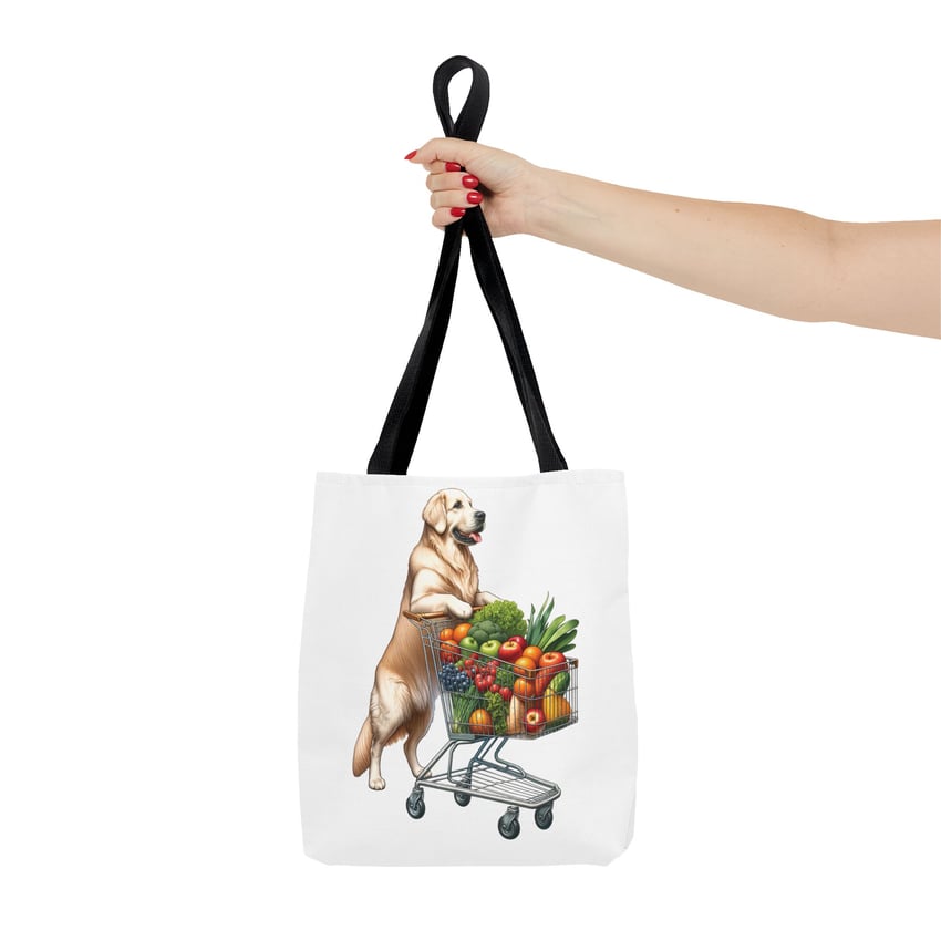 Whimsical golden retriever tote bag with colorful produce and stylish red-nailed hand.