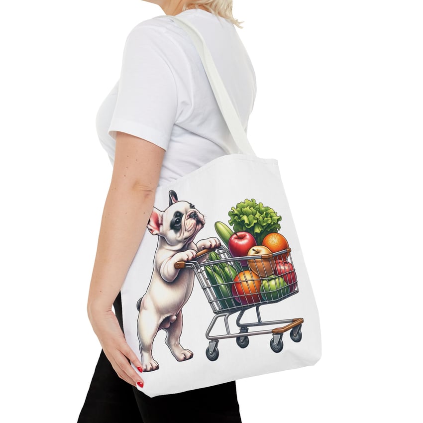 Woman with a French Bulldog tote bag featuring vibrant, whimsical design and colorful produce.