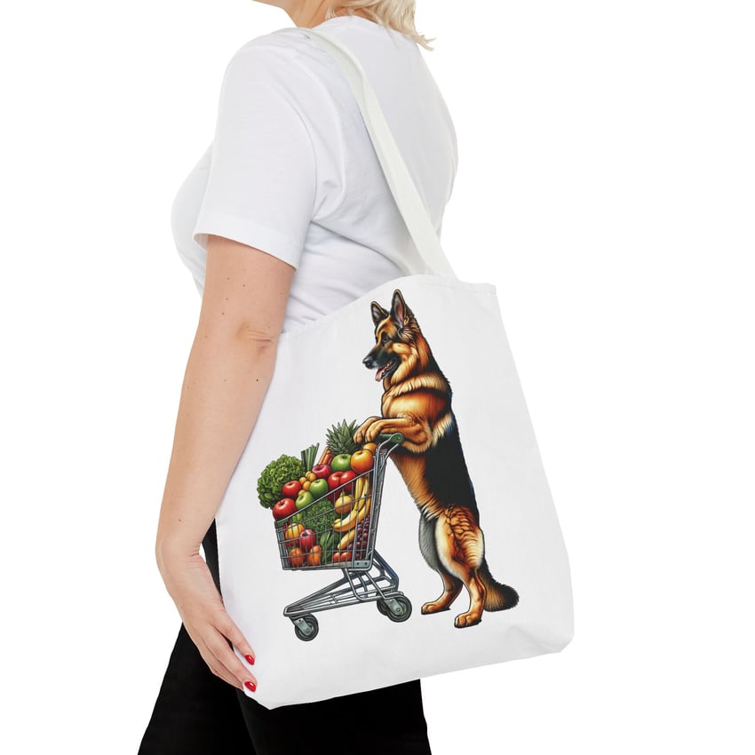 German Shepherd shopping tote with fruits, held by woman in a white T-shirt.