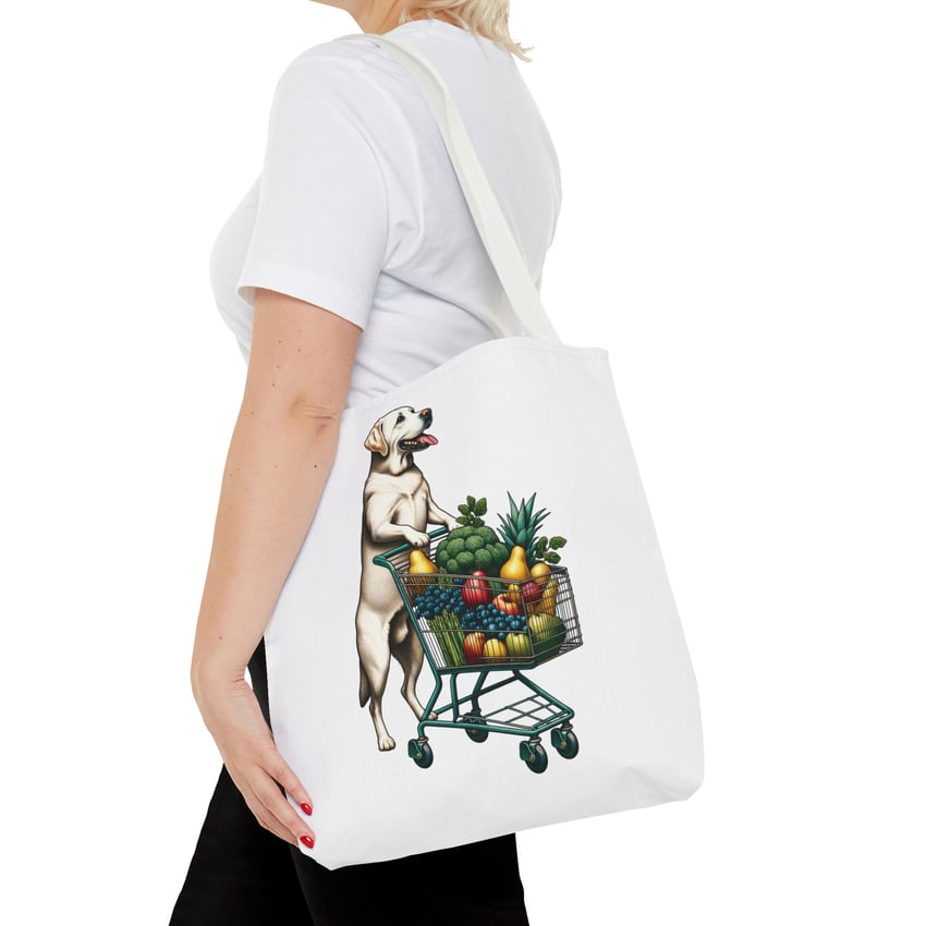 Labrador pushing cart with colorful fruits design on tote bag.