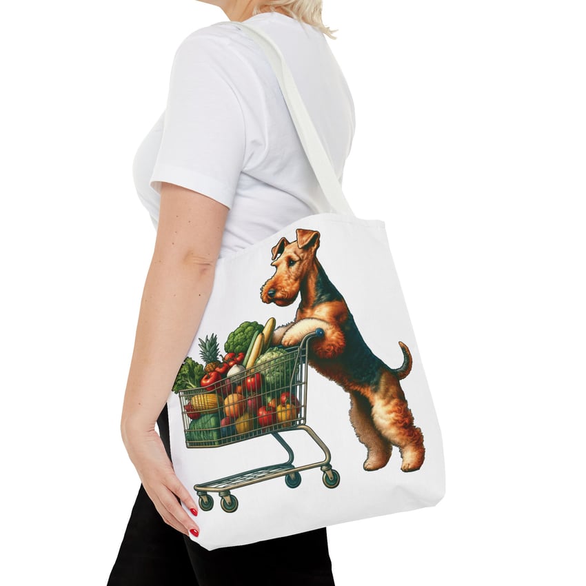 Blonde individual with tote, terrier design, cart of produce; humorous dog lovers accessory.