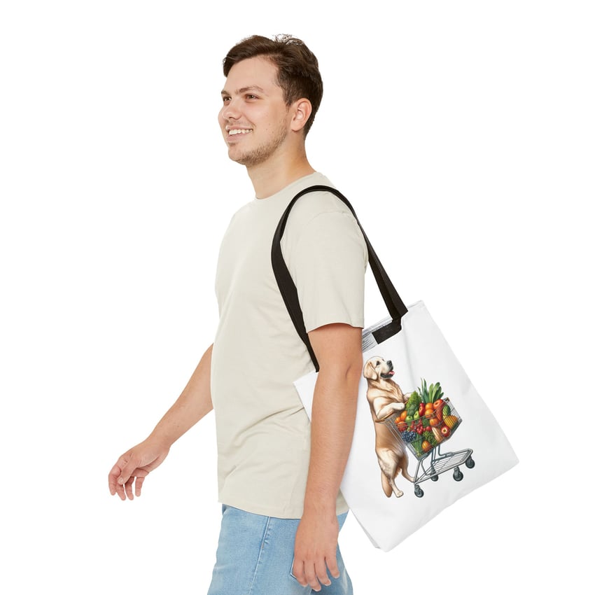 Young man carrying a quirky dog-themed tote bag, enjoying a casual stroll.