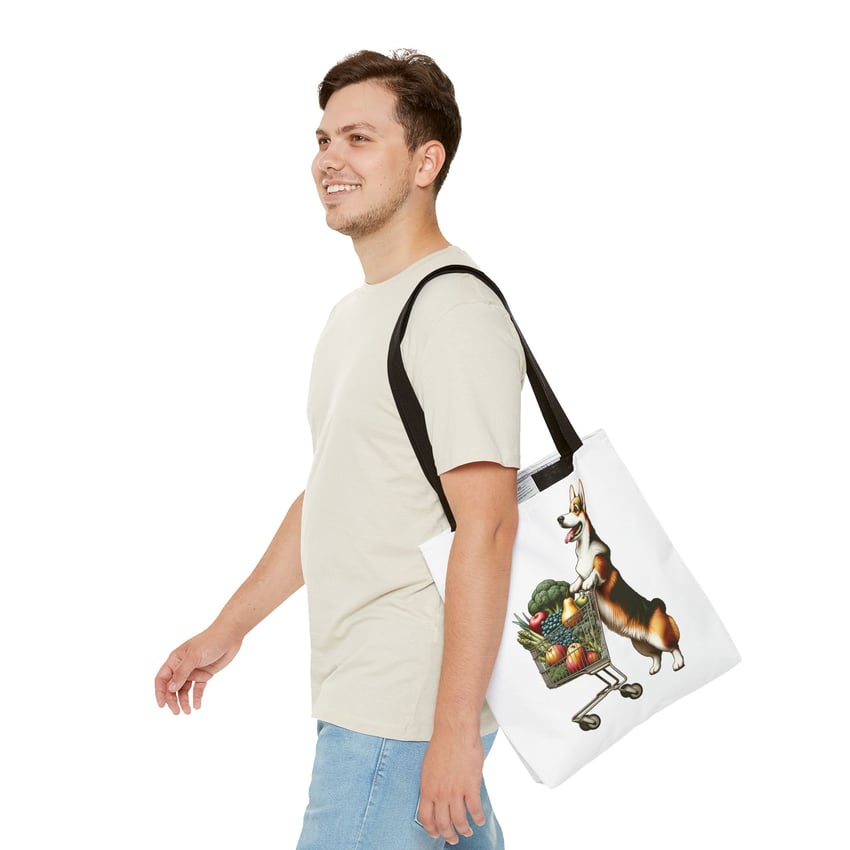 Young man with a corgi tote bag, casual summer attire, white background.