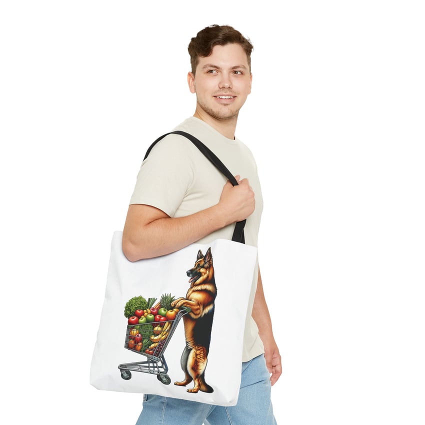 Young man smiling with whimsical tote bag featuring German Shepherd cartoon.